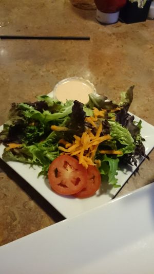 Side salad with vegan thousand island dressing  at Trio Bar and Grill in Columbia