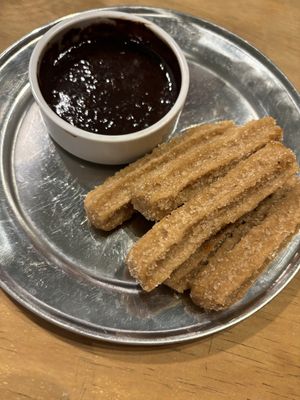 Churros con salsa de chocolate   at Verde Pistacho in Buenos Aires