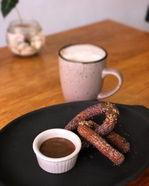 Churros con jamaica, acompañados de cajeta de coco, vaina de vainilla y anis  at Nanita in Oaxaca