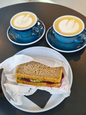 Oat milk Cappuccinos and Tempeh Sandwich at Coffeedesk Kawiarnia - Tamka in Warsaw