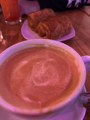 Oat milk latte and chocolate croissant   at Spicy Moon  - Bowery in New York City