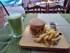 Vegan falafel burger with humous, spicy sauce and green smoothie at MIDO'S in Chefchaouen