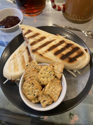 Bacon & Mozzarella Panini with crackers & BBQ sauce  at Canterbury Tails Cat Cafe in Canterbury