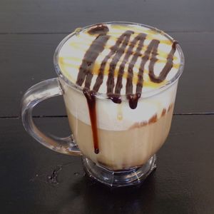 Turtle Mocha Latte with Oat Milk at C.A.T. Cafe Bakery in Huntsville