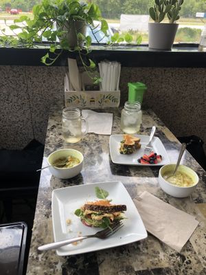 Smashed chickpea bread sandwich and broccoli soup (vegan soup of the day choice). Forgot to take picture until after we had started eating😡 at The Garden in Deland