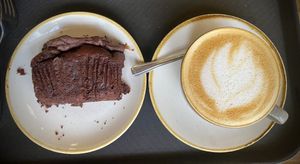 Chocolate and banana cake (vg) and oat flat white   at Cafe 3 Sixty in Newton Abbot
