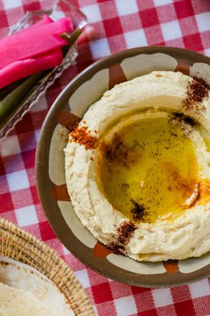 Classic hommos, served with smoked paprika, semmek and olive oil. at Suwayda Streetfood in Krakow