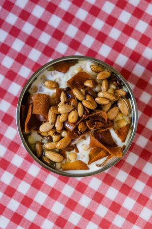 Wegetarian Syrian breakfast - fatteh. Chickpeas, fried arabic bread, cumin yogurt with tahina, pouring butter and pistachios 😍 at Suwayda Streetfood in Krakow