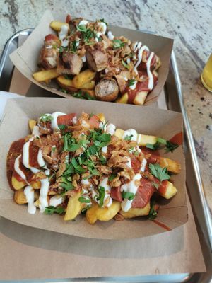 Up is non vegan Currywurst option, below is the vegan option at Frittenwerk - Mall of Berlin in Berlin