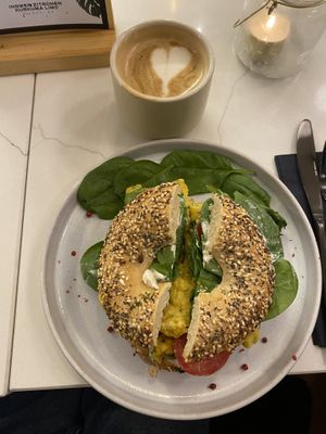 Vegan bagel with vegan cream cheese, tomato, spinach and vegan egg (7,50€) + small Cappuccino with soy milk (3,90€)  at OH Bagel in Muenster