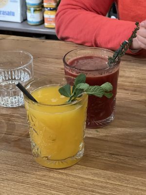 Orange juice and juice of the day (beet, apple, & ginger)  at De Deli in Amsterdam