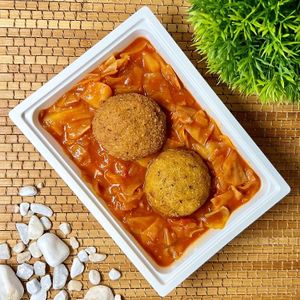 Tomato cabbage stew with vegetable millet meatballs at Vegasef  in Budapest