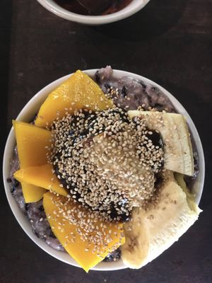Black rice and coconut milk dessert topped with mango, banana, toasted sesame seeds and tamarind jam   at Tamarind - A Taste of Laos in Luang Prabang