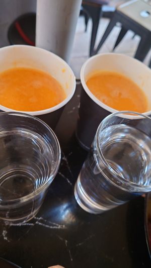 Freshly pressed orange juices and free water at Early Bites in Athens