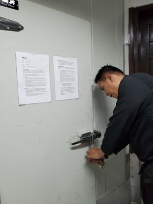 Head Chef Marlon entering the restaurant's freezers. Note that for the kitchen, both freezers and refrigeration have backup generators. at Atlantis Restaurant in Puerto Galera
