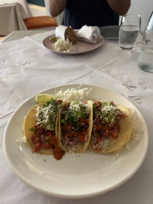 Vegan tacos with burrito in the background   at Indo Mexicano in Bugibba