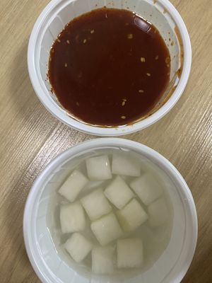 The seasoned spicy sauce (which wasn’t actually spicy) and complementary radish kimchi(?)  at Vampire's Chicken in Seoul