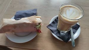 Baguette with vegan "meat" and a large latte. at MiiT in Riga