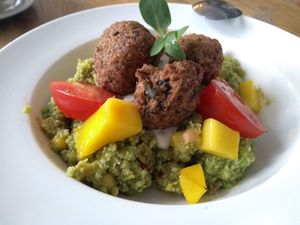 Mexican falafel bowl: the bottom is raw cauliflower cous cous and the yellow chunks are actually fresh mango!
 at MiiT in Riga