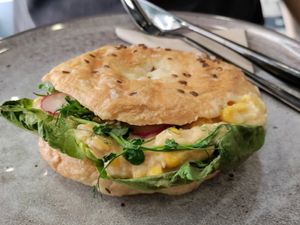 Chickpea and corn sandwich in a crunchy bagel bun at VíK - Vegan Venue in Bratislava