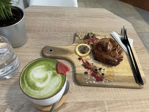 Soy matcha latte & almond pastry  at VíK - Vegan Venue in Bratislava