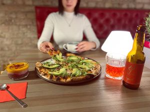 veg avocado pizza at Innocent Cafe in Riga