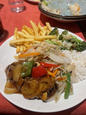Vegan duck is soya sauce, chips, chop suey, broccoli, rice, also had vegan chicken in curry saucee  at Great Asia in Lanzarote