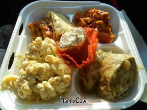 Vegan Thanksgiving feast with stuffed yuba rolls,macaroni & cheeze, lasagna, sweet potatoes w/agave & orange, & pumpkin cheezecake cupcake. at Vegan with Joy in Rancho Cucamonga