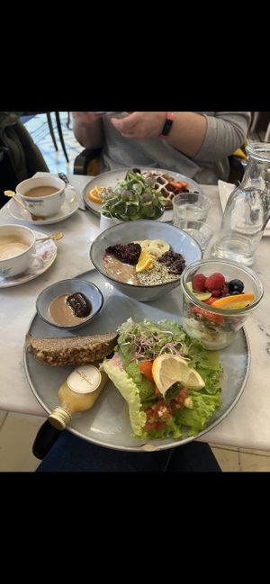 Selection of porridge, granola, avocado bread, banana bread and a ginger shot  at Simply Raw Bakery and Bistro in Vienna