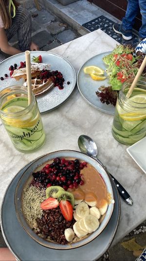 Warm Soul Porridge, Sweet Waffle, Avocado Brot, Detox Water  at Simply Raw Bakery and Bistro in Vienna