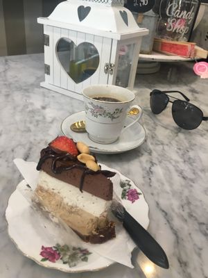 Peanut chocolate cake and Americano coffee at Simply Raw Bakery and Bistro in Vienna