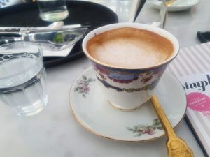 Coffee with housemade almond milk at Simply Raw Bakery and Bistro in Vienna