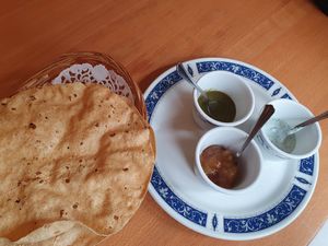 Tandoor roti with sauces (note, white sauce is yoghurt, not vegan) at Indian Tandoori in Bruges