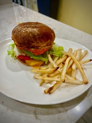 Impossible “chicken” sandwich now available with side fries  at V Cafe  in Long Beach