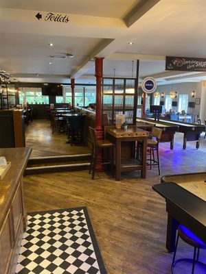 Interior (shuffle board tables on the right)  at Pippin in Maidstone