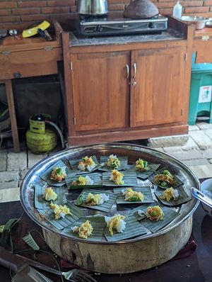 Offering to the gods - bit of rice and urab at Anandinii Organic Garden & Kitchen in Sidemen