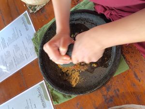 Preparing the salad dressing at Anandinii Organic Garden & Kitchen in Sidemen