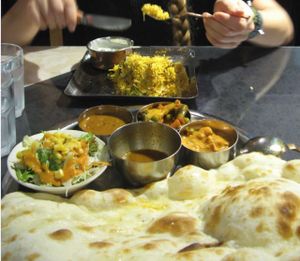 Upper one: rice dish, lower one: lunch set including three curries, a soup, salad and Naan. October 2015 at Vege Herb Saga in Tokyo