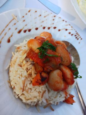 Baked white beans in tomato sauce on Lebanese rice, main (full serving about double photo) at Du Liban-Libanon Restaurant in Frankfurt