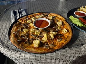 Pizza with pineapple and mushrooms  at Soley Bar in Kuta