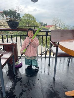 daughter is cleaning the view point at Village Pub & Cafe in Lao Cai