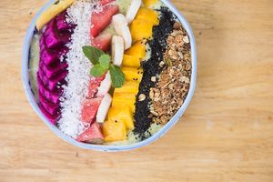 Vegan Green Smoothie Bowl. Avocado, Spinach, White Dragon Fruit, Homemade Peanut Butter, topped with seasonal fresh fruit, granola and chia seeds! at Ground Zero Martial Arts and Yoga Cafe in Siem Reap