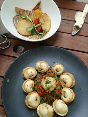 Front: vareniki. Back: tofu, quinoa, vegetables at Avocado Cafe - Tverskaja in Moscow