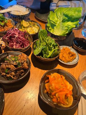 Vegan, sharing, platter, kimchi, lettuce to wrap, mushrooms, cucumber, salad, Red cabbage, beansprouts, spinach, Tofu, jackfruit and Eda, Mami, frittatas. Plus different sauces at Arc in Stockholm