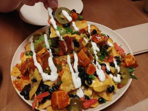 $7.95 Nachos: Really good. The cheese sauce is delicious at Veggie Grill by Next Level - Santana Row in San Jose