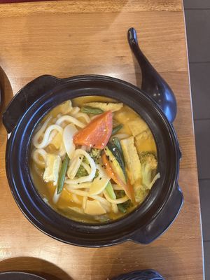 Roasted udon noodles with tofu on curry sauce  at Yobi Food in Pardubice