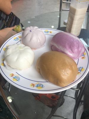 Taro bun, mushroom bun (small ones), Japanese potato bun and brown sugar bun with no filling  (big ones) at Pun-Pao Steamed Buns in Chiang Mai