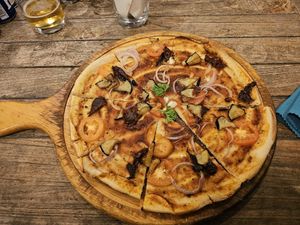 The "Not So Vegan" pizza made vegan. at Hermit's Restaurant in Dhigurah