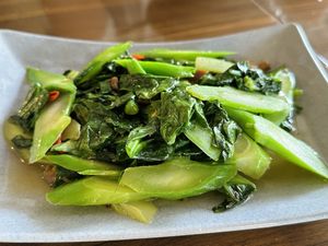 Stir-fried kale with shiitake mushroom (50 THB)  at Kinphak Cafe  in Chiang Mai