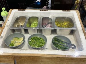 Add your own condiments   at Kinphak Cafe  in Chiang Mai